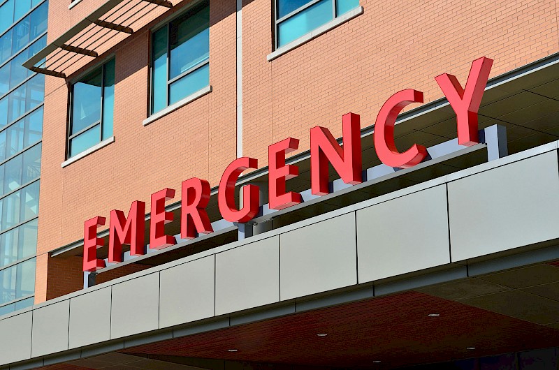 Close up of word 'emergency' on hospital building
