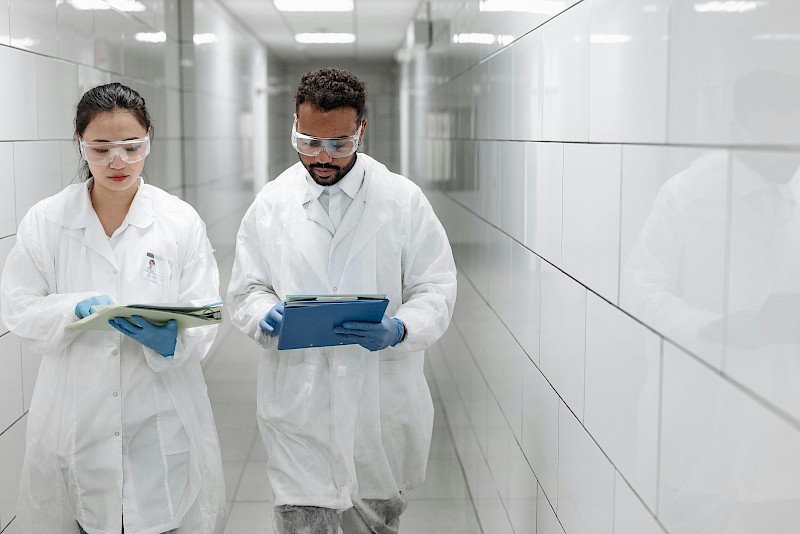 Doctors in white coats with clipboards