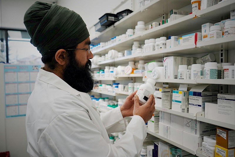 Pharmacist inspecting medicines